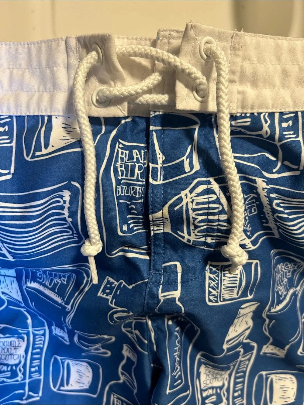Penguin blue men’s swim trunk alcohol bottles, size 34